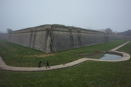 Two people walk their dog through the moat of La Cuidadela at the park of La Vuelta del Castillo amidst dense fog.
Pamplona is a small town north of Spain dawned under a dense fog with a temperature of only three degrees Celsius.