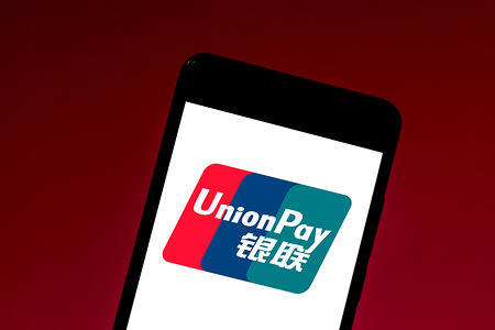 In this photo illustration a UnionPay (CUP) logo seen displayed on a smartphone.