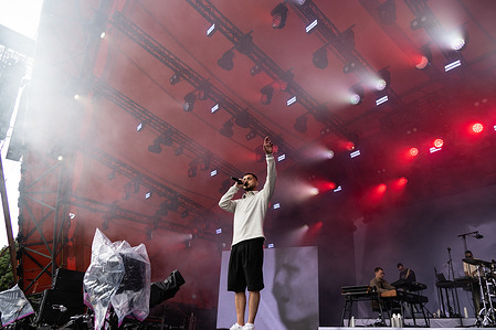 Danish-Albanian artist Ardit Aliti known professionally as Artigeardit performs live on the Orange Stage at Roskilde Festival 2025. The festival is the largest of its kind in the Nordics with an expected 130,000 participants during the 7 days the festival spans. The camping area opens four days before the festival. The headline acts include Olivia Rodrigo, Charli XCX, Fontaines D.C. and MØ.