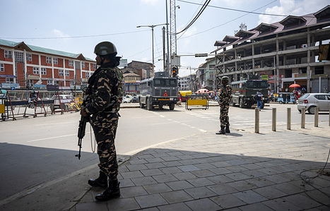 Indian security forces stand alert on a road leading to Srinagar Airport following the explosions According to media reports, officials confirmed that multiple explosions were heard near Srinagar International Airport, which is located next to an Army airfield.