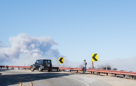 Residents of Topanga seen on standby at Topanga Canyon Road watching the Woolsey Fire in the distance.