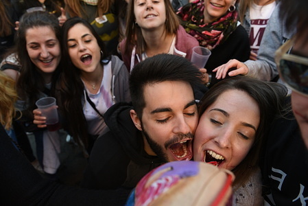 Revellers are seen drinking wine during the celebration.
Thousands of people visit the headquarters of the twelve 'Cuadrillas' (associations of revellers) of the city of Soria, north of Spain, to celebrate the 13th century tradition of 'El Catapan'. They are welcomed with wine, around 7.000 liters, bread, cheese and dry cod.