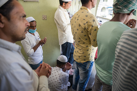 People attend Eid al-Fitr prayers at Kashmiri Masjid in Kathmandu. Muslims around the world celebrate Eid al-Fitr, the three days festival marking the end of Ramadan.