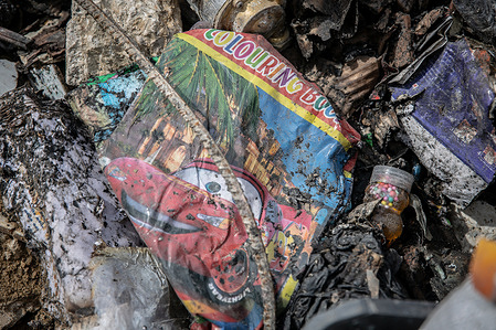 A colouring book seen in rubble , three days after an Israeli airstrike on a pharmacy which killed dozens of people. All-out war between Israel and Hezbollah restarted on March 2, after Hezbollah fired rockets towards Israeli territory, following a 15-month ceasefire where Israel continued to attack on a near-daily basis.
