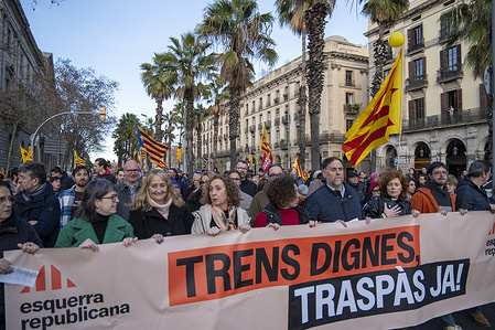 Politicians from the Catalan pro-independence party Esquerra, including its president Oriol Junqueras, hold a banner during the demonstration. Demonstration in central Barcelona calling for improvements to the public rail service following accidents in Catalonia and Andalusia that have triggered a railway crisis in Spain.