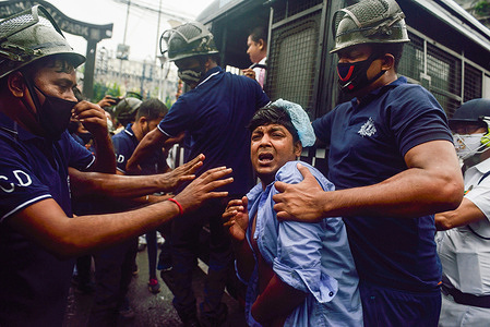 Police officers arrest congress workers during the demonstration.
Congress workers held a protest against the National Monetisation Pipeline (NMP) launched by the Indian Finance Minister Nirmala Sitharaman in front of BJP (Bharatiya Janata Party) Headquarter. Through the NMP the government plans to raise billions by leasing out state owned infrastructure assets over the next four year. But according to the oppositions it's a plan to sell the country's infrastructure assets to businessmen and industrialists close to the present BJP government.