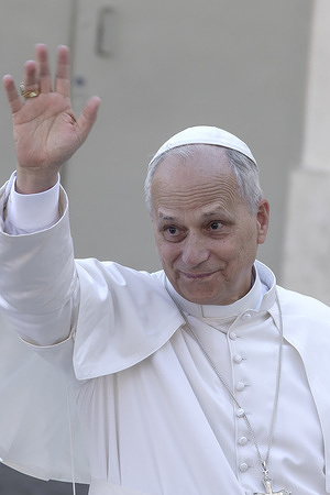 Pope Leo XIV waves at the faithful at the end of a Mass for the canonization of seven new saints in St. Peter's Square at the Vatican. The Pope canonized the martyrs Peter To Rot, Bishop Ignatius Choukrallah Maloyan, the nuns Maria Troncatti, Vincenza Maria Poloni, Carmen Rendiles Martínez, and the laypeople Bartolo Longo and José Gregorio Hernández Cisnerosin.