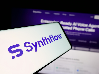 In this photo illustration, a smartphone with the logo of German company AgentFlow AI GmbH (Synthflow) is seen on screen in front of website.