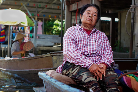 A boatman is seen resting at the Damnoen Saduak Floating Market.