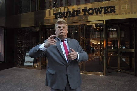 A person impersonating Donald Trump and wearing a Donald Trump mask is seen in front of Trump Tower on Fifth Avenue in Manhattan, New York City.