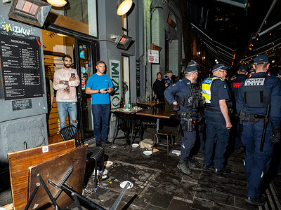 Miznon storefront seen damaged during the anti-police protest in Melbourne. Miznon, an Israeli restaurant in Melbourne’s iconic Hardware Lane, became a crime scene after a protest escalated into chaos—demonstrators clashed with staff, overturned tables, and smashed plates and glass, following news that co-owner Shahar Segal had joined the US-backed Gaza Humanitarian Foundation as a spokesperson. Several protesters were arrested.