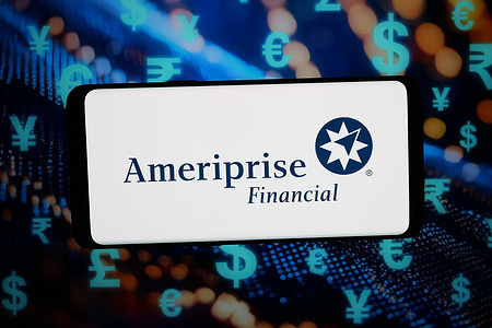 In this photo illustration, the logo of US company Ameriprise Financial Inc. is displayed on a smartphone in front of abstract background on computer screen.