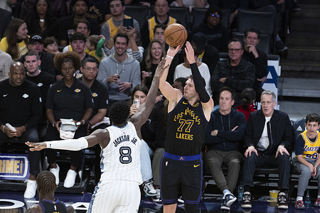 Los Angeles Lakers’ Luka Dončić (77) and Memphis Grizzlies' Jaren Jackson Jr. (8) seen in action during an NBA basketball game at Crypto.com Arena. Final score Lakers 128 : 121 Grizzlies