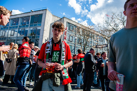 A NEC fan is seen drinking before the game started. Thousands of NEC Nijmegen fans gathered in the center to watch the Dutch Final cup against AZ Alkmaar football team. The game that was played at the Feyenoord Stadium, in Rotterdam ended with the victory of the AZ Alkmaar 1-5.