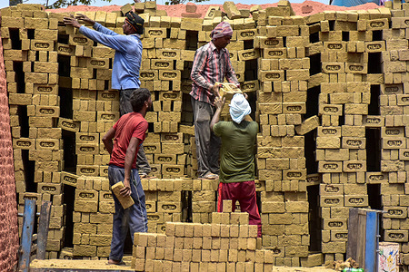 Foreign laborers work at a brick kiln in Srinagar, the summer capital of Jammu and Kashmir.