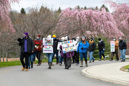 Striking healthcare workers seen marching in front of Tyler Memorial Hospital with placards expressing their opinion during the demonstration.
Striking healthcare workers picket in front of Tyler Memorial Hospital. The three-day unfair labor practices strike follows months of unproductive negotiations with hospital management.