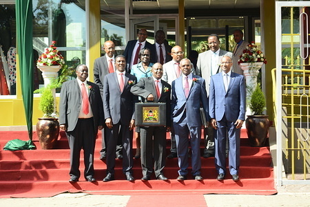 National Treasury Cabinet Secretary Henry Rotich (centre) displays the budget briefcase ahead of the reading.
The budget for 2018/19 is estimated at Kshs 3.074 trillion with over half of the allocations going to finance government recurrent expenditure. Kenyans are concerned of the increased taxes and cost of basic commodities.