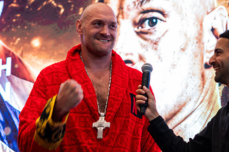 British heavyweight boxer Tyson Fury, (L) speaks during the official weigh-in ahead of his heavyweight bout against Mariusz Wach.