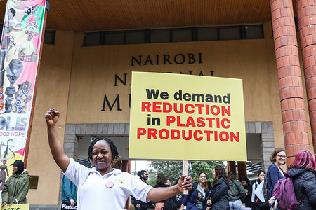 A participant holds a placard during a #BreakFreeFromPlastic March held in Nairobi ahead of UN’s Intergovernmental Negotiating Committee third round of negotiations towards a legally binding plastics Treaty starting Monday at the United Nation Environment program Headquarters.