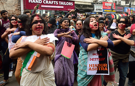 Women performing a Chilean feminist protest piece " Rapist in your path " or " The rapist is you " during a demonstration against violence against women.