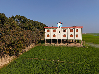 (EDITOR'S NOTE: Image taken by a drone) 
A flood shelter seen beside the Boro rice field at Shonir Haor in Sunamganj, Bangladesh.