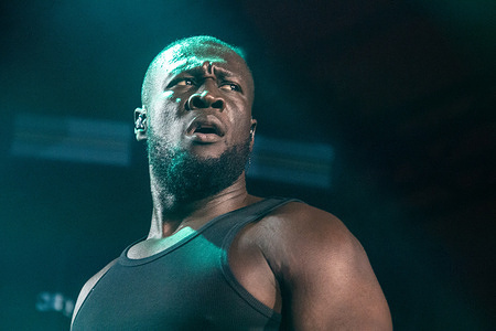 The English-Ghanaian rapper, singer, and songwriter Michael Ebenezer Kwadjo Omari Owuo Jr., known professionally as Stormzy
performs live on the Orange Stage at Roskilde Festival 2025. The festival is the largest of its kind in the Nordics with an expected 130,000 participants during the 7 days of the festival spans. The camping area opened four days before the festival. The headline acts include Olivia Rodrigo, Charli XCX, Fontaines D.C. and MØ.