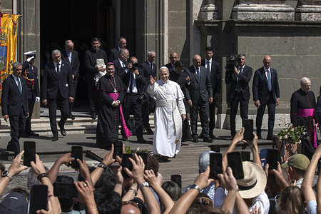 Pope Leo XIV leaves after presiding over a mass at the San Pancrazio cathedral near Castel Gandofo, where the pontiff is spending his summer vacation.