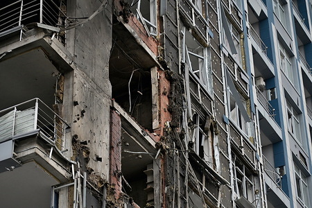 A damaged apartment building hit by a Russian drone strike amid Russia's attack.