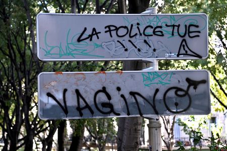 View of an anti-police slogan spray-painted on the back of a signpost in Marseille. The slogan "The Police kill" is spray-painted on the back of a traffic sign in Marseille.