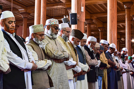 Kashmiri Muslims offer congregational Prayers inside the Grand Mosque (Jamia Masjid) during the first Friday of Ramadan in Srinagar. Muslims throughout the world are marking the month of Ramadan, the holiest month in the Islamic calendar during which devotees fast from dawn till dusk.