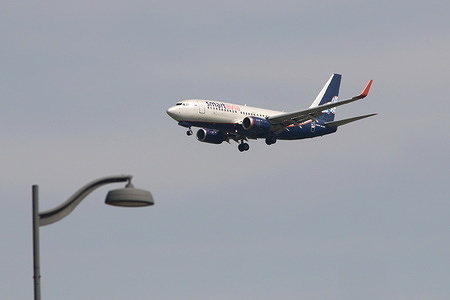 A Boeing 737-752 aircraft of Smart Avia airlines is seen in the sky above Pulkovo Airport.