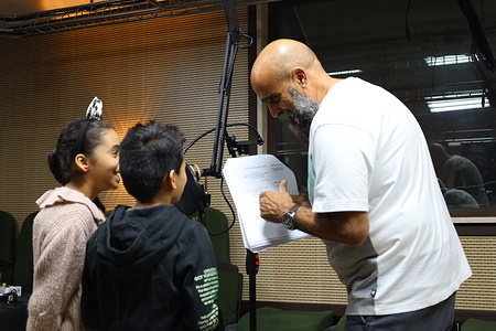 Libyan theater actor Anwar Altair seen training children on an audio cartoon program. The only National Theater in Misurata, which was opened in 1968 and ceased activity in 1976 and reopened again in 2018, to be filled with cinematic shows and cartoon sound recordings.