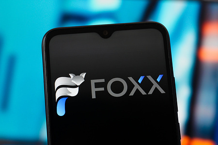 In this photo illustration, the Foxx Development logo is seen displayed on a smartphone screen.