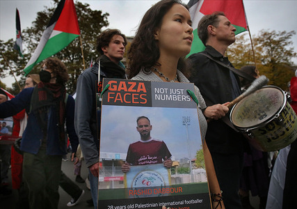 Pro-Palestinian demonstrators march across Cambridge carrying flags and signs showing photos of some of those who have been killed during the war. Around 150 Cambridge students and supporters marched in solidarity with Palestine, commemorating two years since the recent war while drawing attention to the Palestinians’ decades-long struggle. The demonstration brought Friday night traffic in Cambridge to a standstill.