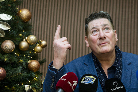 Tony Hadley (C) speaks during a press conference. A musical icon, singer Tony Hadley, frontman of the band Spandau Ballet joined the press conference in Trani (Italy) ahead of the New Year Concert in the sea town, with the local Mayor Amedeo Bottaro.