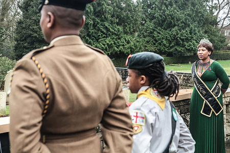 South Africans and military personnel seen during the act of remembrance honouring victims of the SS Mendi at the Hollybrook War Memorial. The SS Mendi sank in the English Channel after a collision in 1917, killing more than 600 people, most of them Black South African men serving in the South African Native Labour Corps en route to France during World War I.
