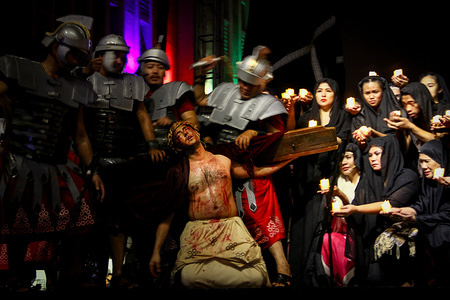 Roman soldiers whip an actor playing as Jesus Christ during the Senakulo in Manila. Members of the Sta. Ana drama club performed a passion play depicting the last few days of Jesus Christ before his crucifixion. The passion play was held outside the Manila Cathedral.