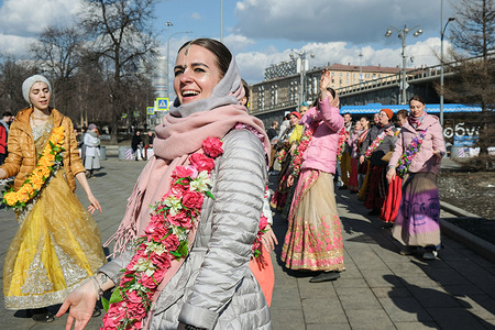 The Hare Krishnas stage a street performance for passers-by in Moscow.