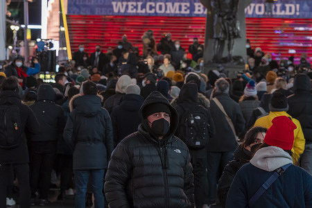 Hundreds of people attend a candlelight vigil in Times Square for Michelle Alyssa Go, who was killed at the Times Square subway station last Saturday in New York City. Forty-year-old Go, an Asian American, was pushed by a stranger in front of a train at the Times Square subway station. Police have arrested a 61-year-old man, Simon Martial, who has a history of mental illness. The incident is the latest high profile crime in the Times Square area.