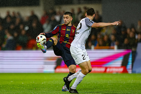 Efthymios Koulouris of Pogon Szczecin (L) and Artur Craciun of Puszcza Niepolomice (R) seen in action during the Polish League PKO BP Ekstraklasa 2024/2025 football match between Puszcza Niepolomice and Pogon Szczecin at Puszcza Stadium. Final score; Puszcza Niepolomice 4 : 5 Pogon Szczecin.