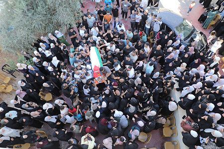 (EDITORS NOTE: Image depicts death) Palestinians including relatives and friends, bid farewell to Imad Haroun Ishtayeh during his funeral in the village of Salem, east of Nablus in the West Bank. Ishtayeh was killed by Israeli forces while crossing the concrete separation barrier between the West Bank and Jerusalem, searching for work inside Israel. He was killed while trying to earn a living.