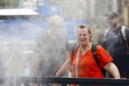 A woman cools off in front of mist cooling fans during extreme heat. The city records extreme heat of up to 43 °C with windy conditions as Fire Weather Warnings are issued across much of Victoria. Authorities have released "leave immediately" notices for bushland areas in Longwood between Seymour and Euroa amid heightened bushfire risk. Multiple fire weather districts including Central, North Central, North East, Gippsland, Mallee, Wimmera and South West Victoria remain on alert.