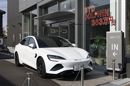 A car from a Chinese electric car manufacturer, BYD (Build Your Dreams), is seen in front of its dealership store.