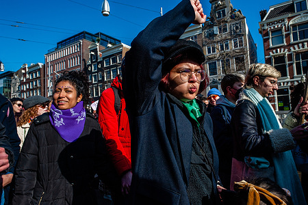 A protester gestures during the demonstration.
In the weekend leading up to International Women's Day, several organizations called for a demonstration to raise awareness of the importance of, among other things, sexual and reproductive rights, the climate, and to stand up against violence and sexually transgressive behavior. Hundreds of women and men gathered at the Dam Square in the city center to make a collective sound heard.