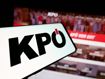 In this photo illustration, a smartphone with the logo of party Kommunistische Partei Österreichs (KPÖ) is seen on screen in front of website.