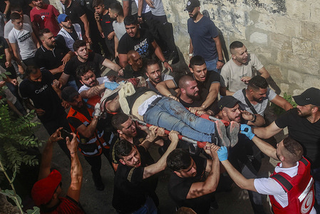 (EDITORS NOTE: Image depicts death) 
Palestinians retrieve the bodies of two Palestinians who were killed by an Israeli spicial force gunfire in the Old City of Nablus, in the northern West Bank. An Israeli special forces unit infiltrated the old town of Nablus and assassinated two Palestinian gunmen. The special forces withdrew after the Israeli army forces came and secured the area.