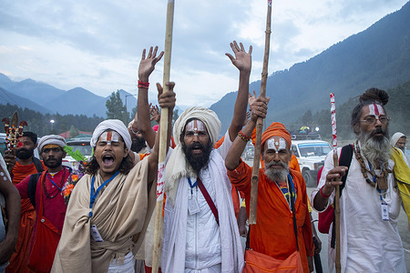 Hindu pilgrims chant religious slogans during the annual pilgrimage to the sacred Amarnath Caves, one of Hinduism’s most revered shrines. Thousands of devotees braving subzero temperatures begin the steep trek over glaciers and narrow paths above deep gorges to reach the cave which houses a naturally formed ice stalagmite worshipped as a symbol of the Hindu god Shiva. Pahalgam, the key and traditional route as well as the main base camp for the pilgrimage, was the site of a deadly militant attack on April 22 that killed 26 Hindu tourists and triggered the worst escalation between nuclear-armed rivals India and Pakistan in decades. More than 300,000 devotees are expected to take part in this year's two-month pilgrimage which is taking place under heightened security with Indian paramilitary forces, police, sharpshooters and drones deployed along the route to prevent further violence in the disputed Himalayan region where militants have been fighting Indian rule since 1989.