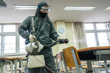 A worker wearing protective gear disinfects a classroom as they prepare to reopen the school.
South Korean authorities announced that schools will start reopening from Wednesday, May 13, after holding online classes for several weeks due to the coronavirus outbreak. 3rd grade students in High school will be the first to go back to school on May 13, followed by younger pupils who will gradually return between May 20 and June 1.