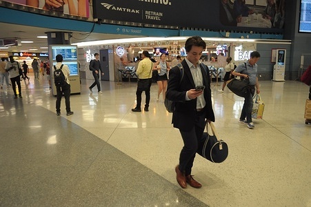 People walk in Penn Station, Manhattan, New York City.