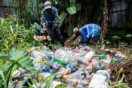 Volunteers from Sana Mare Organization, an environmental nonprofit remove plastic waste from Kiambu River following a heavy downpour that swept trash through storm water drains into the river. UN Delegates are meeting for the Intergovernmental Negotiating Committee's third round of discussions to craft a plastics treaty that will address the menace of plastic pollution.